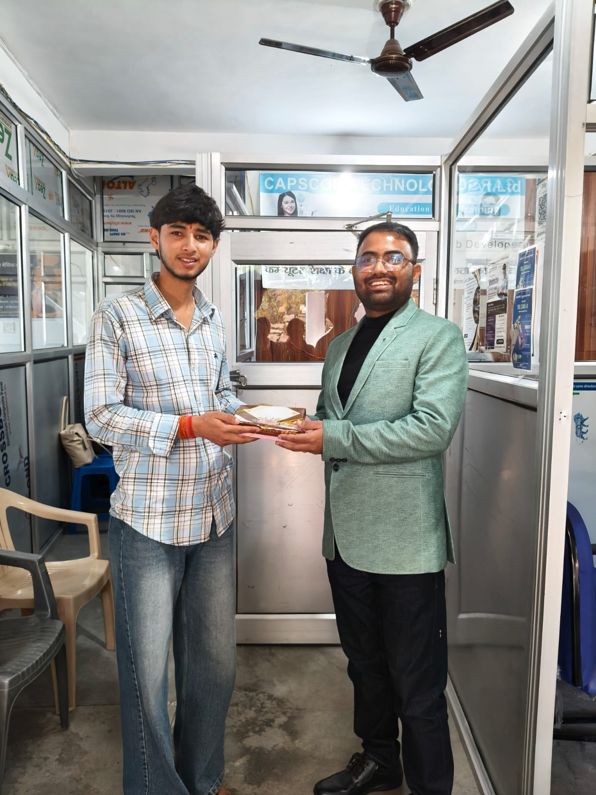 Bhaskar Joshi उपाध्यक्ष बनने के बाद मिठाई देते सी टी कंप्यूटर अल्मोडा में